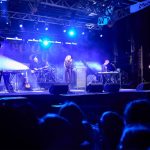 Concert crowd with stage lighting and pyrotechnics at Googfest festival